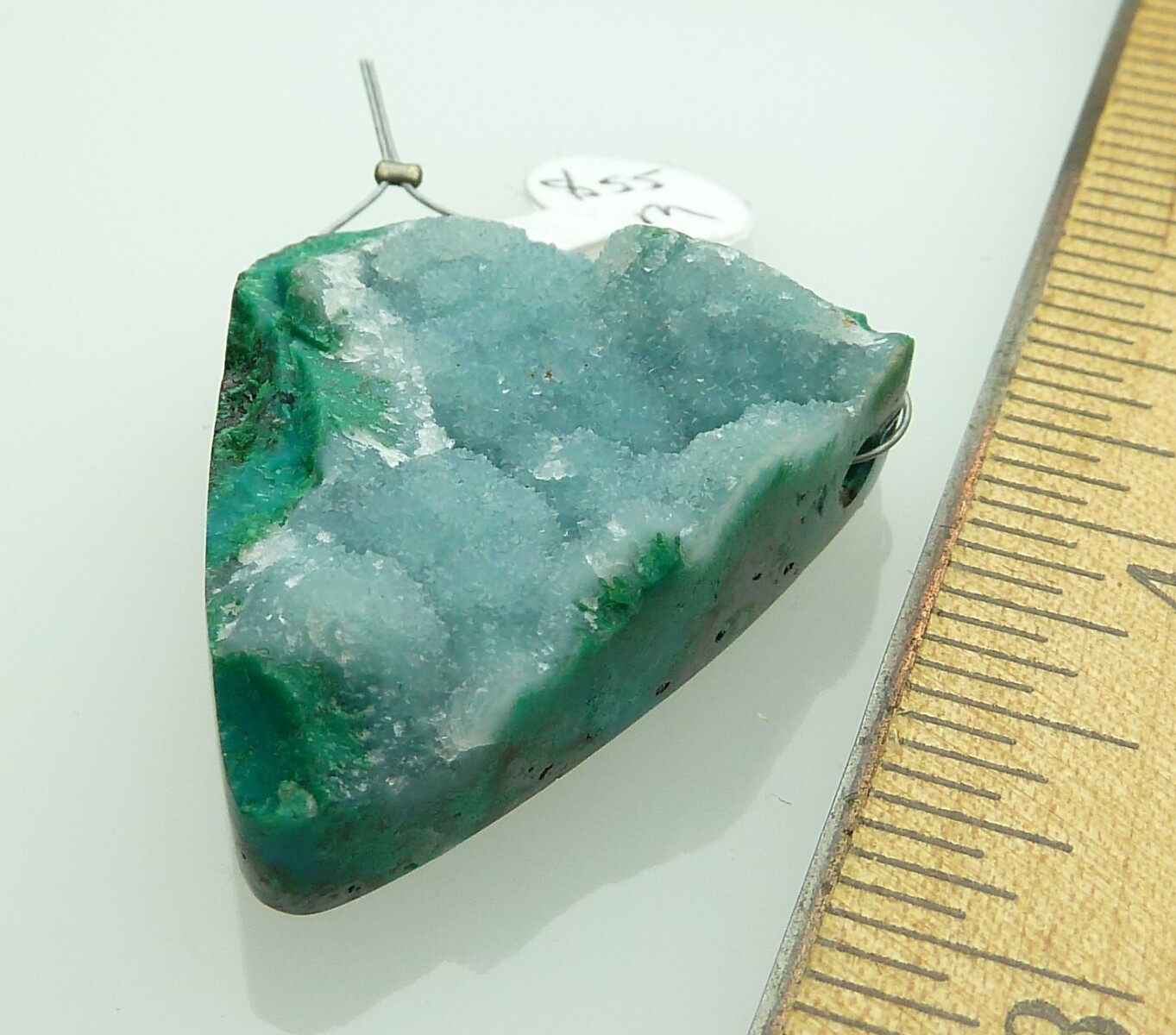 Scaled image P1010803.JPG: Item #Chryso2, Price $55.00 Same pendant different view. Handcut designer Chrysocolla and druzy quartz pendant bead. The druzy is a natural coating on top of the malalchite and chrysocolla. All sides except the top are polished. Bead is 37mm long by 31 mm wide at the top. Bead is drilled through the widest part of the stone. Drill hole size is about 2.5 mm. All this stone needs is a bail or leather to make a beautiful pendant.� 