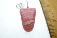 Thumbnail P1010994.JPG: Item #Rhodo1, Price $50.00 Rhodochrosite pendant drop bead. Simple bead cut drilled at the widest part of the bead. Bead is 29mm long by 20mm wide. Bead is drilled at the widest part of the stone and drill hole size is about 2.0 mm. 
