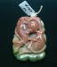 Item #DB10, Price $100.00 length 43mm, 33mm width, thickness 15mm at the top. Carved fancy jasper cut from one stone. It can be used as a pendant since it has a hole drilled in the top or added to your collection of fine carvings. The top side of the bead is carved in the maroon part of this stone. The back side is carved in the green part of this stone. Top side has carved fish shown in photo. Back side has carved lotus leaf.