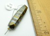 Item #TigerIron1, Price $50.00 Tiger Iron, hematite and golden tiger eye, six sided bead. Drilled through long axis. Bead is darker than the photo. Bead is 32 mm long by 9 mm wide. Drill hole size is about 3.0 mm.