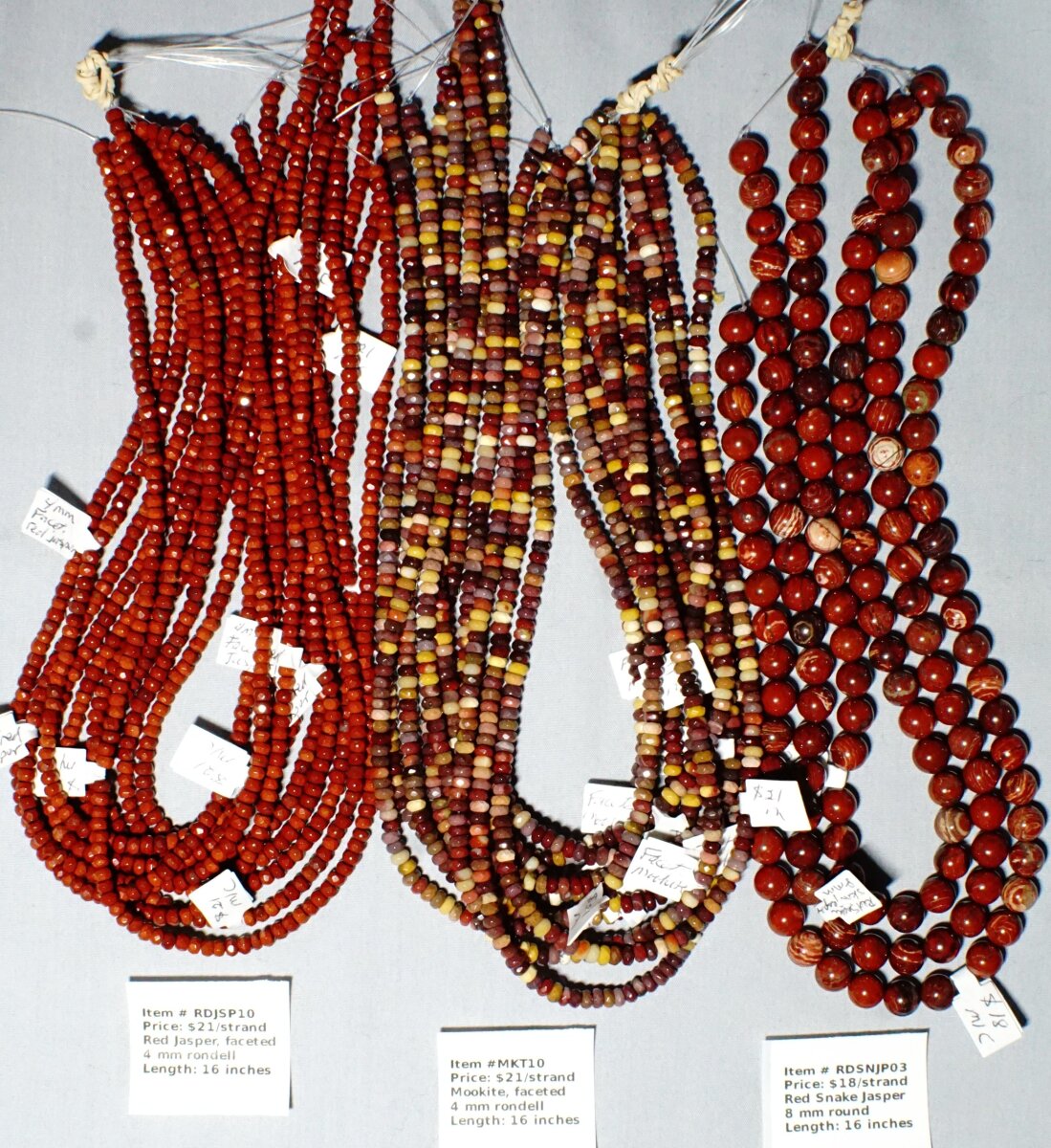 Scaled image Jaspers.JPG: Item # RDJSP10 - Red jasper faceted rondells, 4 mm, $21/strand
Item # MKT10-Mookitem faceted rondell, 4 mm, $21/strand
Item # RDSNJP03-Red Snake Jaspeh, 8 mm round, $18 / strand� 