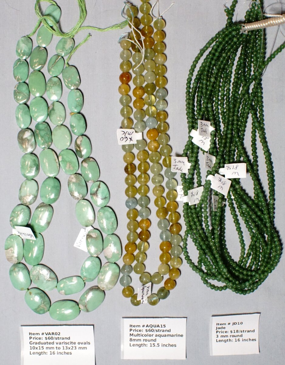 Scaled image VARAQUAJD.JPG: Item # VAR02-Graduated variscite ovals, 10x15 mm to 13x 23 mm, $60/strand
Item # AQUA15-Multicolor Aquamarine, 8 mm, $60/strand
Item # JD10-3mm round jade, $18/strand� 