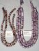 Thumbnail Charoite10-12.JPG: Item # CHAR12-Charoite, 10 mm round, $ 45/strand
Item # CHAR10-Charoite, 6 sided barrells, $80/strand 