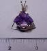 Thumbnail 12010059.jpg: Item # AM1 Price $75.00 Fancy cut faceted Amethyst with cut leaves on the back of the stone and hand wire wrapped in 14 kt gold filled wire. � 