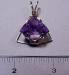 Item # AM1  Price $75.00 Fancy cut faceted Amethyst with cut leaves on the back of the stone and hand wire wrapped in 14 kt gold filled wire.