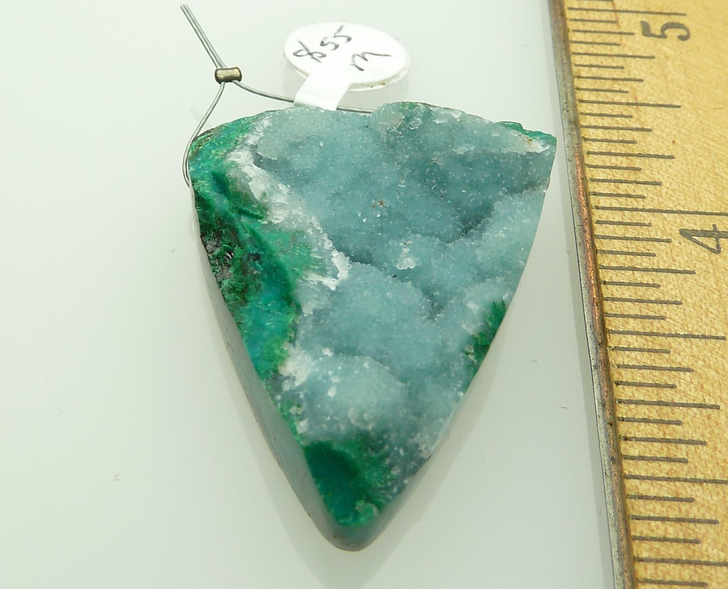 Scaled image P1010791.JPG: Item #Chryso2, Price $55.00 Handcut designer Chrysocolla and druzy quartz pendant bead. The druzy is a natural coating on top of the malalchite and chrysocolla. All sides except the top are polished. Bead is 37mm long by 31 mm wide at the top. Bead is drilled through the widest part of the stone. Drill hole size is about 2.5 mm. All this stone needs is a bail or leather strand to make a beautiful pendant. � 